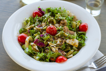 Greek salad with tomatoes and crackers