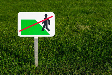 "keep off the grass" sign