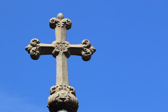 Christian cross on blue sky background