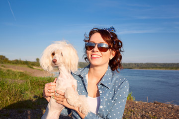 young beautiful woman girl on background of sunflower field