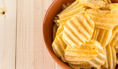 potato chips on wood background