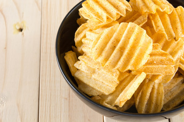 potato chips on wood background