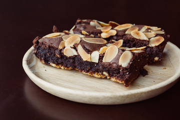 chocolate brownies on wood plate