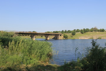 Fototapeta na wymiar Bridge across river