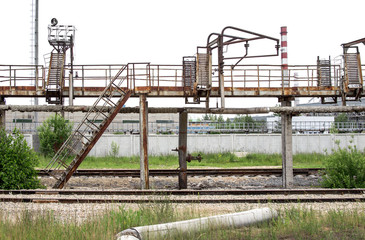 Naklejka premium old rusty staircase from warehouse to cat walk