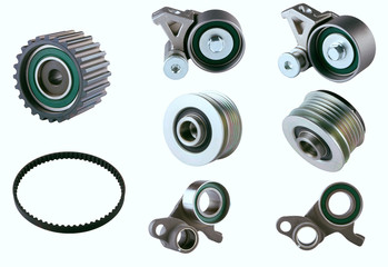 Rubber PV, gear belts and rollers for the car engine on a white