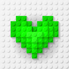 Green heart made of construction kit