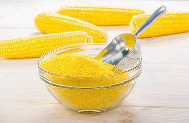corn grits on a wooden background