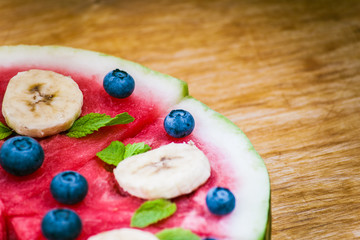 Watermelon pizza on wood