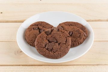 soft dark chocolate brownie cookies on wood