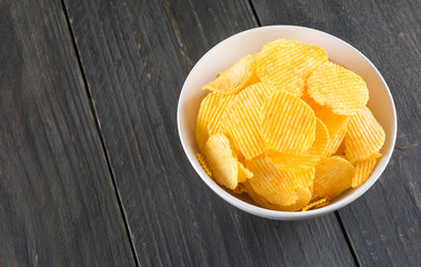 potato chips on wood background