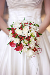 Wedding bouquet at bride's hands