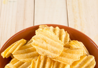potato chips on wood background