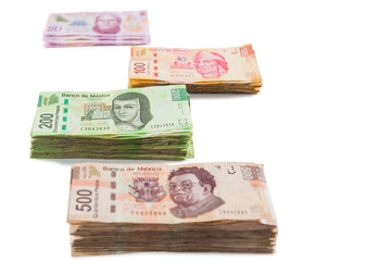 Obraz na płótnie Canvas Mexican money isolated on white /selective focus