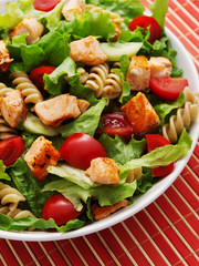 Salad with salmon, cherry tomatos and pasta