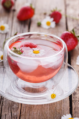 Strawberry drink in a glass with ice.