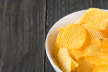 potato chips on wood background