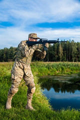 Fototapeta premium Soldier with a rifle