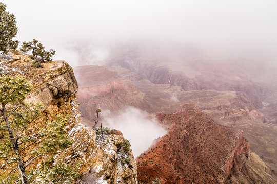 Grand Canyon in November early winter. Beautiful foggy and cloudy landscape view of Grand Canyons Arizona