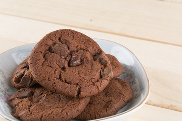 soft dark chocolate brownie cookies on wood
