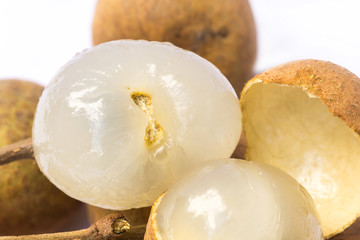 Close up of longan fruit on a white background.