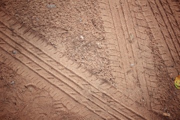 Wheel tracks on the soil.
