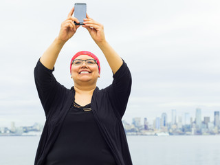 Woman Takes Selfie With Downtown Skyline In Background