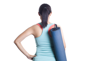 Young woman holding a yoga mat