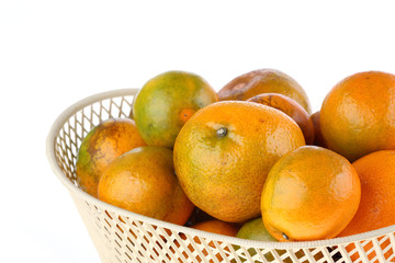 orange fruit in basket, isolated on white background