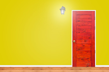 Wooden door and lamp with isolated yellow wall texture.