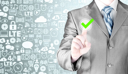 business man touching, pressing modern button with green ticking