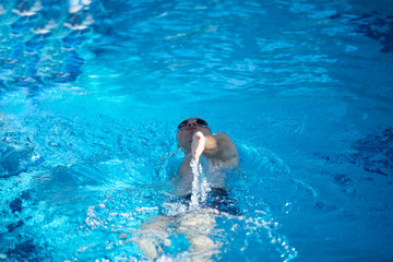 swimmer excercise on indoor swimming poo