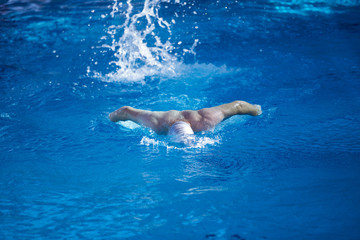 Fototapeta na wymiar swimmer excercise on indoor swimming poo