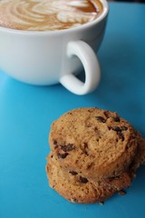 Chocolate chip cookies with latte art coffee
