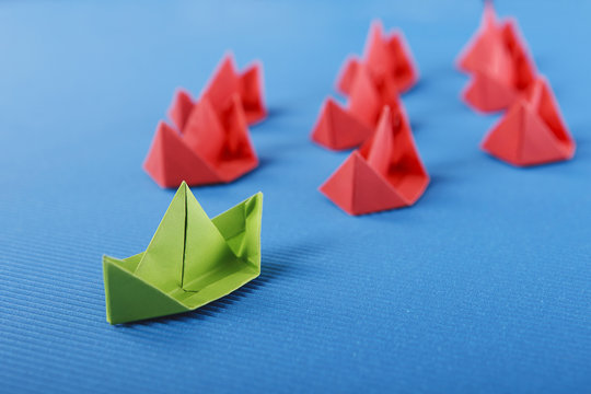 Paper boat in ocean. Blue ocean marketing concept.