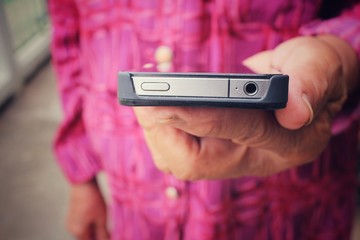 Senior using smart phone