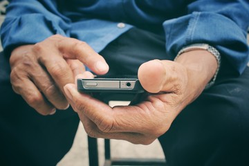 Senior man using smart phone