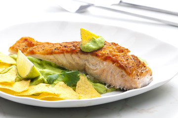 grilled salmon fillet with avocado sauce and nachos
