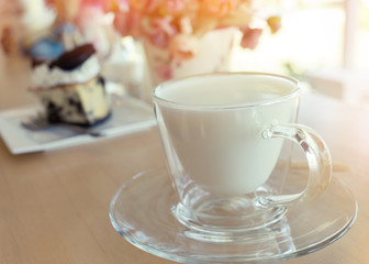 Obraz na płótnie Canvas hot drink milk with cake in the morning