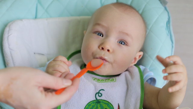 Mother Feeding Little Baby