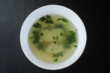 close up of a bowl chicken soup stock