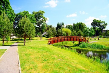 Fototapeta premium Bridge over pond in Viesintos village Anyksciai district