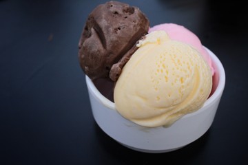 Ice cream chocolate with strawberry and vanilla