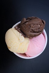 Ice cream chocolate with strawberry and vanilla