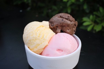 Ice cream chocolate with strawberry and vanilla