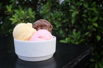 Ice cream chocolate with strawberry and vanilla