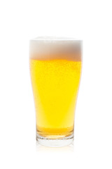 Isolated single glass of beer with bubbles