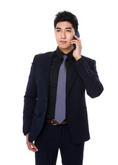 Fototapeta premium Asian businessman talk to smartphone