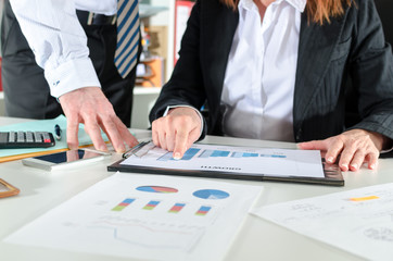 Business people talking about business performance