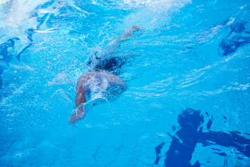 swimmer excercise on indoor swimming poo
